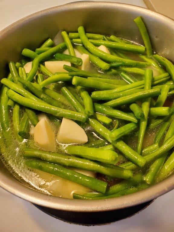 Green beans and potatoes cooking