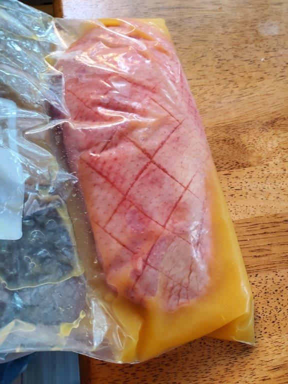 Duck in plastic bag with marinade