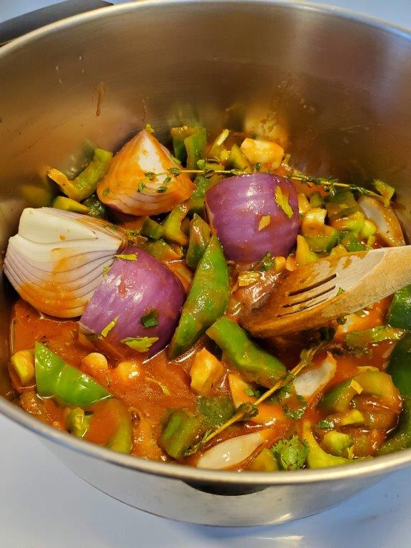 Vegetables in the pot with the chicken
