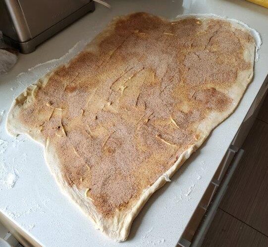 Rolled out cardamom bun dough