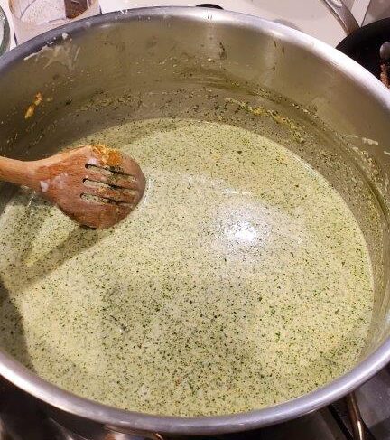 Simmering cassava leaf curry