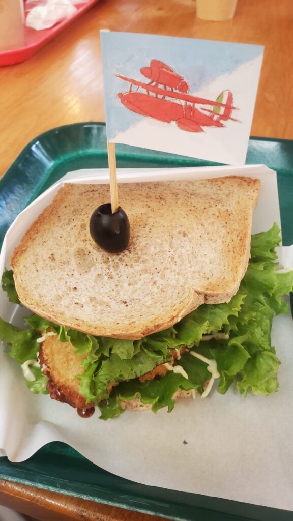 Pork cutlet sandwich with biplane flag.