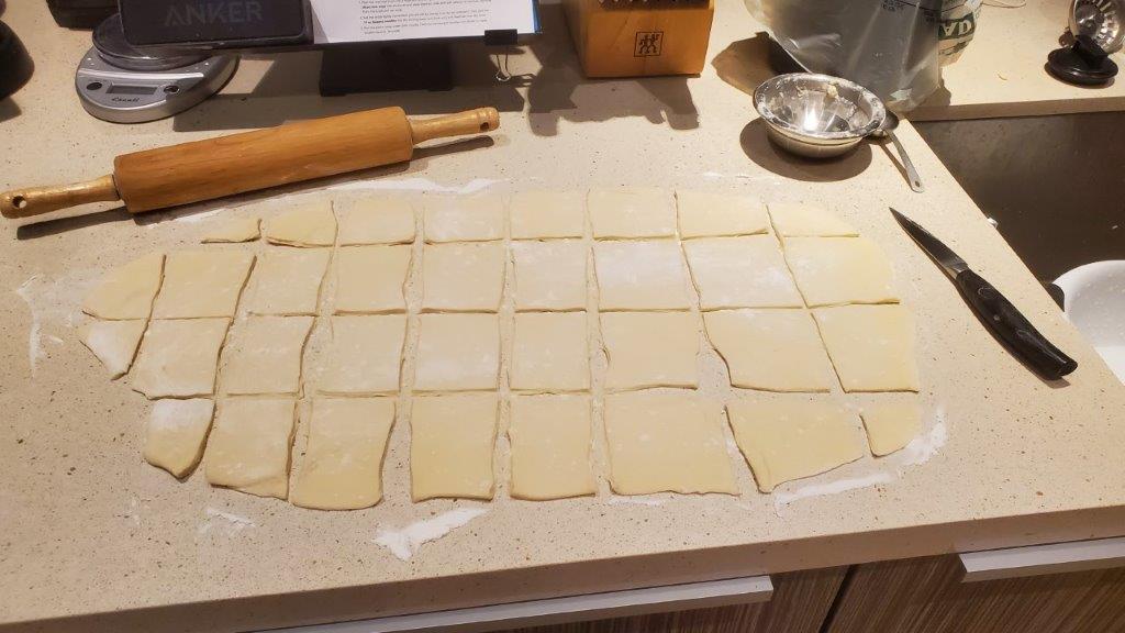 Dough rolled out and cut into squares